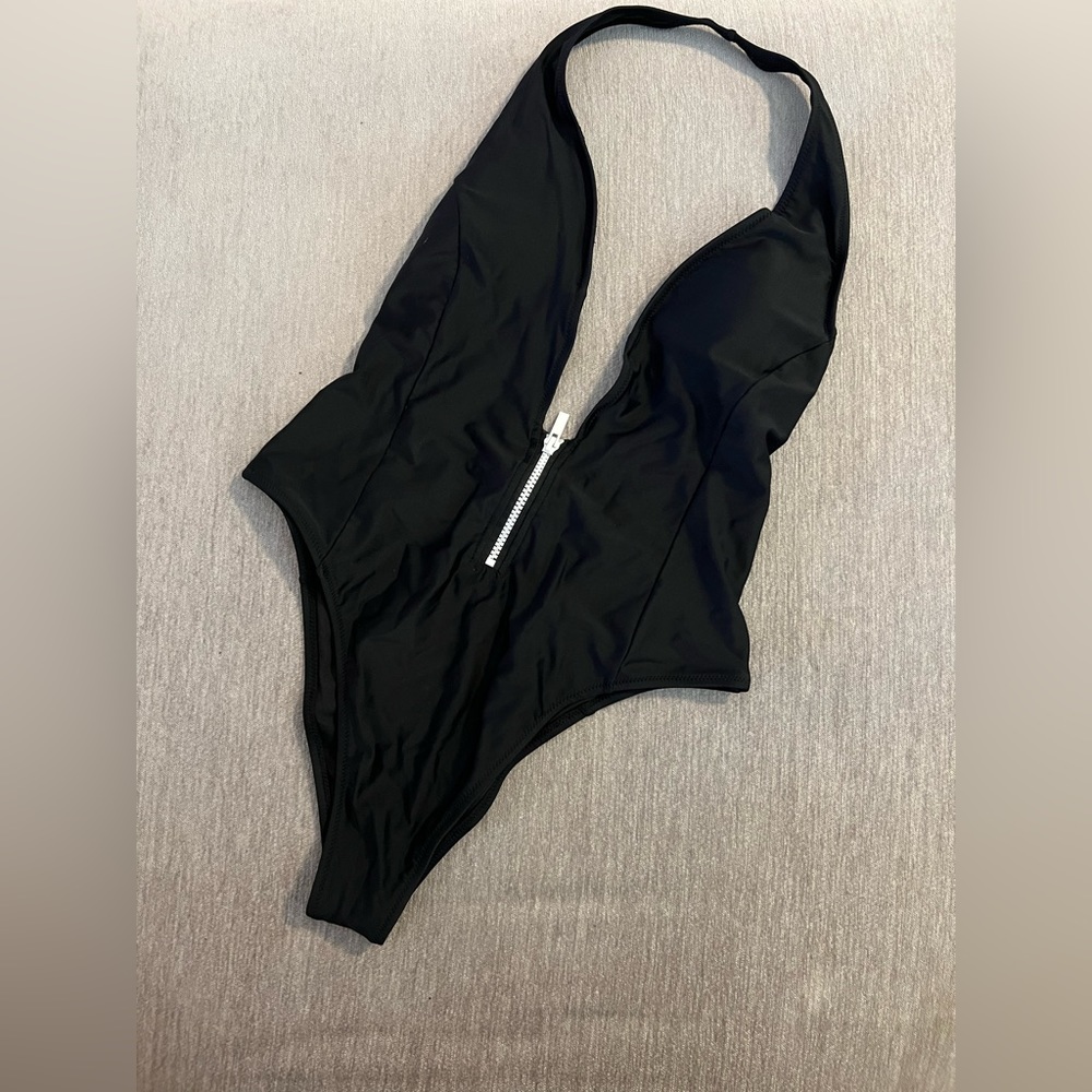 Low cut black one piece bathing suit